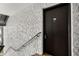 Exterior entrance with stairs and dark door at 3245 Beneva Rd # 201, Sarasota, FL 34232