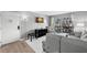 Living room features gray sectional sofa and access to balcony at 3245 Beneva Rd # 201, Sarasota, FL 34232