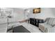 Open living room with gray sectional sofa and view of dining area at 3245 Beneva Rd # 201, Sarasota, FL 34232