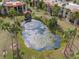 Serene pond with lush landscaping and gazebo at 3245 Beneva Rd # 201, Sarasota, FL 34232