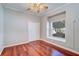 Bedroom with hardwood floors, window seat, and closet at 335 Palmdale Dr, Oldsmar, FL 34677