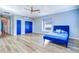 Bedroom with hardwood floors, ceiling fan, and closet at 335 Palmdale Dr, Oldsmar, FL 34677