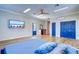 Bedroom with hardwood floors, ceiling fan, and closet at 335 Palmdale Dr, Oldsmar, FL 34677
