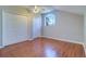 Spacious bedroom with vaulted ceilings, a ceiling fan, and ample closet space at 335 Palmdale Dr, Oldsmar, FL 34677