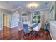Open-concept dining room featuring hardwood floors and elegant finishes and plenty of natural light at 335 Palmdale Dr, Oldsmar, FL 34677