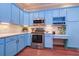 Bright kitchen features stainless steel appliances, stylish cabinetry, and marble countertops at 335 Palmdale Dr, Oldsmar, FL 34677