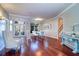 Elegant living room showcases hardwood floors, staircase, and large front windows at 335 Palmdale Dr, Oldsmar, FL 34677