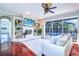 Open living room with built-in shelving, fireplace, and access to an enclosed pool area at 335 Palmdale Dr, Oldsmar, FL 34677
