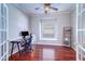 Bright office space with hardwood floors, natural light, and a stylish desk setup at 335 Palmdale Dr, Oldsmar, FL 34677