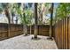 Private backyard oasis with brick pavers and lush landscaping at 3629 Gulf Blvd, St Pete Beach, FL 33706