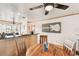 Bright dining area with wood table and kitchen access at 3629 Gulf Blvd, St Pete Beach, FL 33706