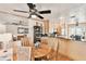 Charming dining area with wood table and kitchen views at 3629 Gulf Blvd, St Pete Beach, FL 33706