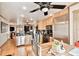 Open kitchen with stainless steel appliances and hardwood floors at 3629 Gulf Blvd, St Pete Beach, FL 33706