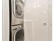 Laundry closet with stacked LG washer and dryer at 3629 Gulf Blvd, St Pete Beach, FL 33706