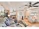 Open living room with hardwood floors and large windows at 3629 Gulf Blvd, St Pete Beach, FL 33706