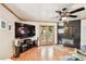 Comfortable living room with hardwood floors and fireplace at 3629 Gulf Blvd, St Pete Beach, FL 33706