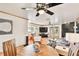 Relaxing living room with TV, fireplace, and hardwood floors at 3629 Gulf Blvd, St Pete Beach, FL 33706