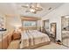 Spacious main bedroom with a king-size bed and large windows at 3629 Gulf Blvd, St Pete Beach, FL 33706