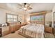 Bright main bedroom featuring a king bed and built-in storage at 3629 Gulf Blvd, St Pete Beach, FL 33706