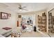 Home office with a desk, comfortable seating, and large windows at 3629 Gulf Blvd, St Pete Beach, FL 33706