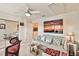 Bright office features a sectional sofa and large ocean-themed artwork at 3629 Gulf Blvd, St Pete Beach, FL 33706
