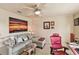 Comfortable office space with a sofa, desk, and large artwork at 3629 Gulf Blvd, St Pete Beach, FL 33706