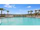 Inviting community pool overlooking a lake at 3828 Turning Tides Ter, Bradenton, FL 34208