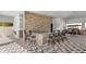 Outdoor kitchen and bar with seating in the pool area at 3836 Turning Tides Ter, Bradenton, FL 34208