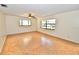 Bright living room featuring wood-look floors and large windows at 4409 Ann Arbor Dr, Tampa, FL 33610