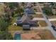 Aerial view of house with pool and paved driveway at 5052 Florentine Ct, Spring Hill, FL 34608