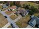 Aerial view showing a house with a pool and a large paved driveway at 5052 Florentine Ct, Spring Hill, FL 34608