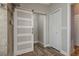 Bathroom with barn door and linen closet at 5052 Florentine Ct, Spring Hill, FL 34608