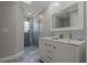 Elegant bathroom with double vanity and shower at 5052 Florentine Ct, Spring Hill, FL 34608