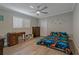 bedroom with dinosaur bedding and dresser at 5052 Florentine Ct, Spring Hill, FL 34608
