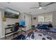 Bedroom with gaming setup and large TV at 5052 Florentine Ct, Spring Hill, FL 34608