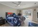 Bedroom with pool view and ceiling fan at 5052 Florentine Ct, Spring Hill, FL 34608