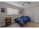 Cozy bedroom with wooden desk and window blinds at 5052 Florentine Ct, Spring Hill, FL 34608