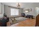Bright dining room with hardwood floors and large window at 5052 Florentine Ct, Spring Hill, FL 34608