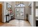 Bright and airy entryway with tiled floors and double doors at 5052 Florentine Ct, Spring Hill, FL 34608