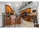 Eat-in kitchen with breakfast bar and wood cabinetry at 5052 Florentine Ct, Spring Hill, FL 34608