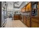 Well-equipped kitchen with wood cabinets and stainless steel appliances at 5052 Florentine Ct, Spring Hill, FL 34608