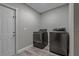 Bright laundry room with washer and dryer at 5052 Florentine Ct, Spring Hill, FL 34608