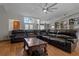 Relaxing living room with a large sectional sofa and hardwood floors at 5052 Florentine Ct, Spring Hill, FL 34608