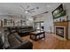Spacious living room with fireplace, hardwood floors and comfortable seating at 5052 Florentine Ct, Spring Hill, FL 34608