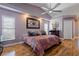 Spacious main bedroom with hardwood floors and ceiling fan at 5052 Florentine Ct, Spring Hill, FL 34608