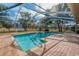 Screened pool with brick patio at 5052 Florentine Ct, Spring Hill, FL 34608