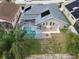 Property features a pool, fenced backyard, and solar panels at 5206 Whispering Leaf Trl, Valrico, FL 33596