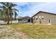 Spacious backyard oasis featuring a private pool and screened enclosure at 5206 Whispering Leaf Trl, Valrico, FL 33596