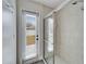 Bathroom with updated shower and private exterior access at 5206 Whispering Leaf Trl, Valrico, FL 33596