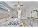 Main bedroom with king bed, walk-in closet, and wood floors at 5206 Whispering Leaf Trl, Valrico, FL 33596